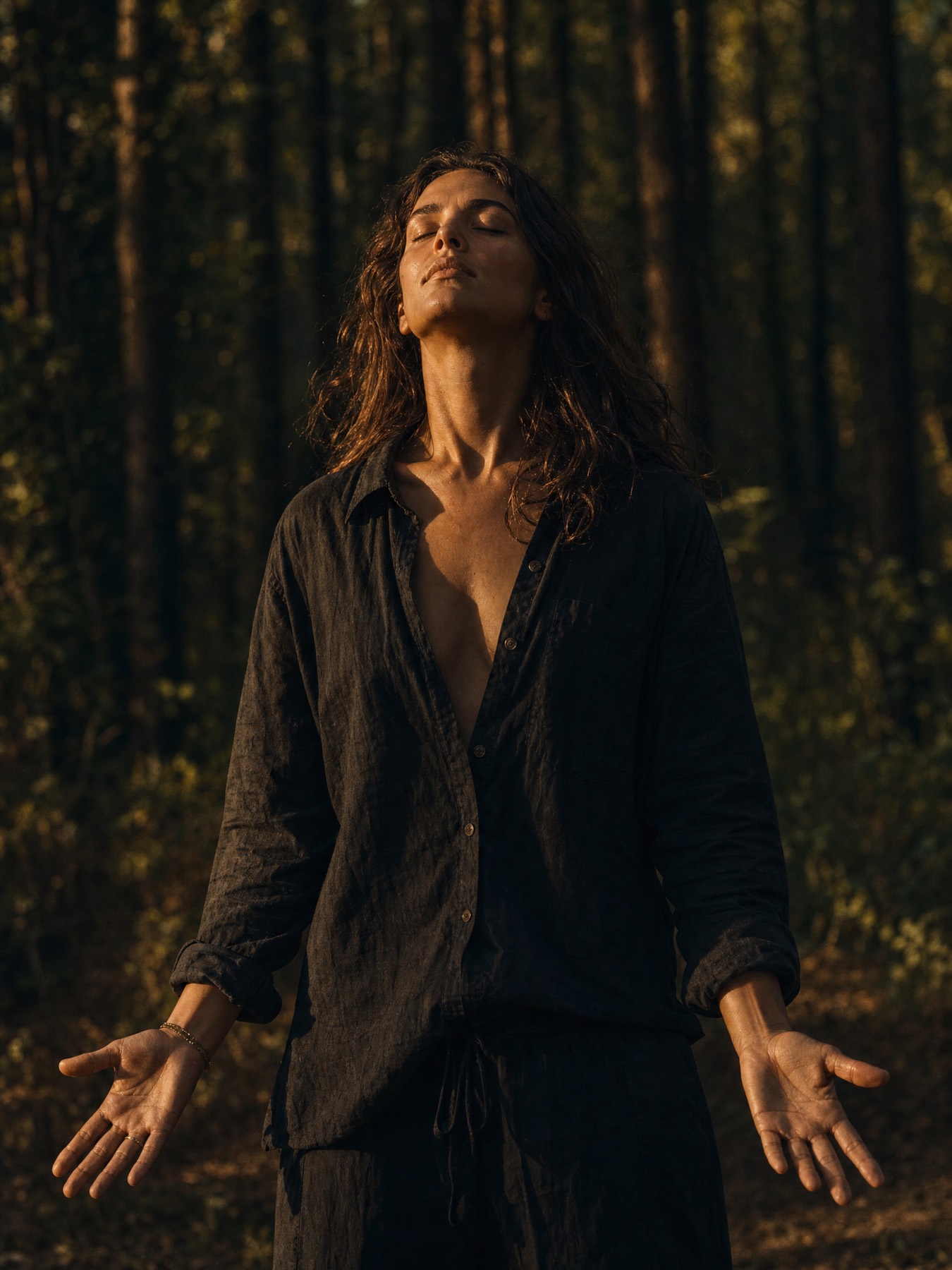 A woman in powerful emotional presence in a forest