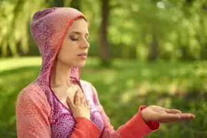 A person embracing their painful emotions with compassion and understanding