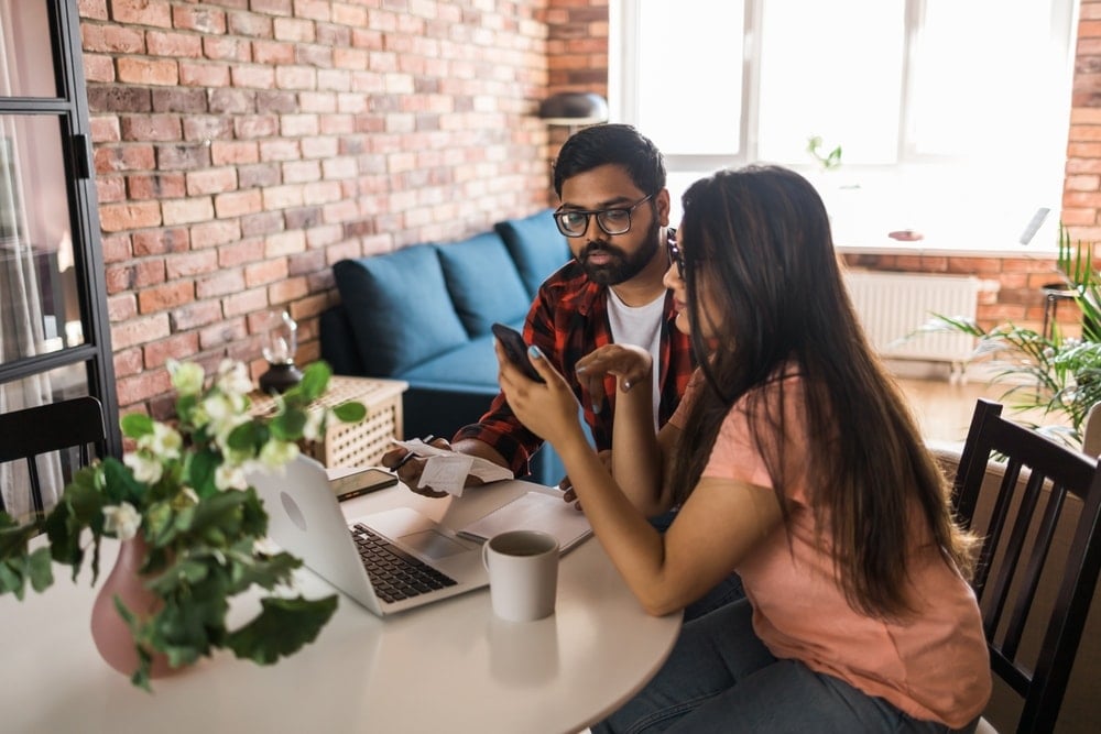 A person reviewing their insurance policy with a focus on therapy coverage, emphasizing the importance of understanding insurance details.