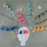 A drawing of a head with "ADHD" letters inside, surrounded by colorful pipe cleaners and flower decorations on a gray background—perfect for raising awareness about ADHD in adults and teens or promoting CBT therapy.