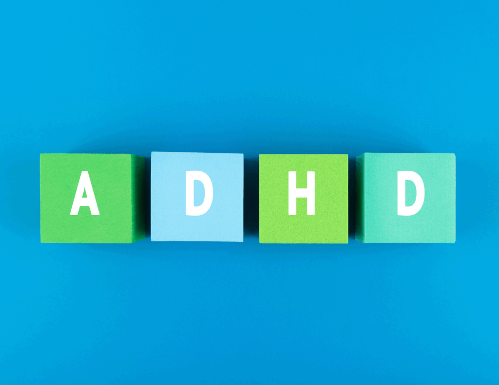 Four colored blocks on a blue background, each with a white letter spelling out "ADHD," symbolize effective ADHD treatment and ways to manage symptoms.
