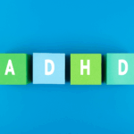 Four colored blocks on a blue background, each with a white letter spelling out "ADHD," symbolize effective ADHD treatment and ways to manage symptoms.