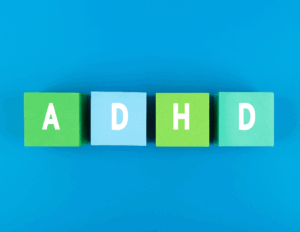 Four colored blocks on a blue background, each with a white letter spelling out "ADHD," symbolize effective ADHD treatment and ways to manage symptoms.