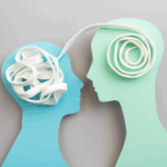 Two silhouette cutouts face each other; a tangled white cord is inside one head and a neatly coiled cord leads to the other, symbolizing how empathy can untangle thoughts and foster clearer communication or knowledge transfer.
